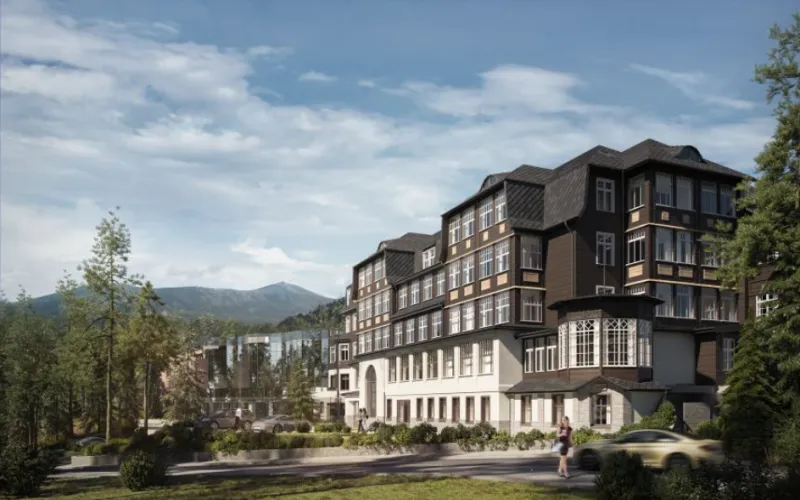 Widok na duży, luksusowy hotel na tle gór